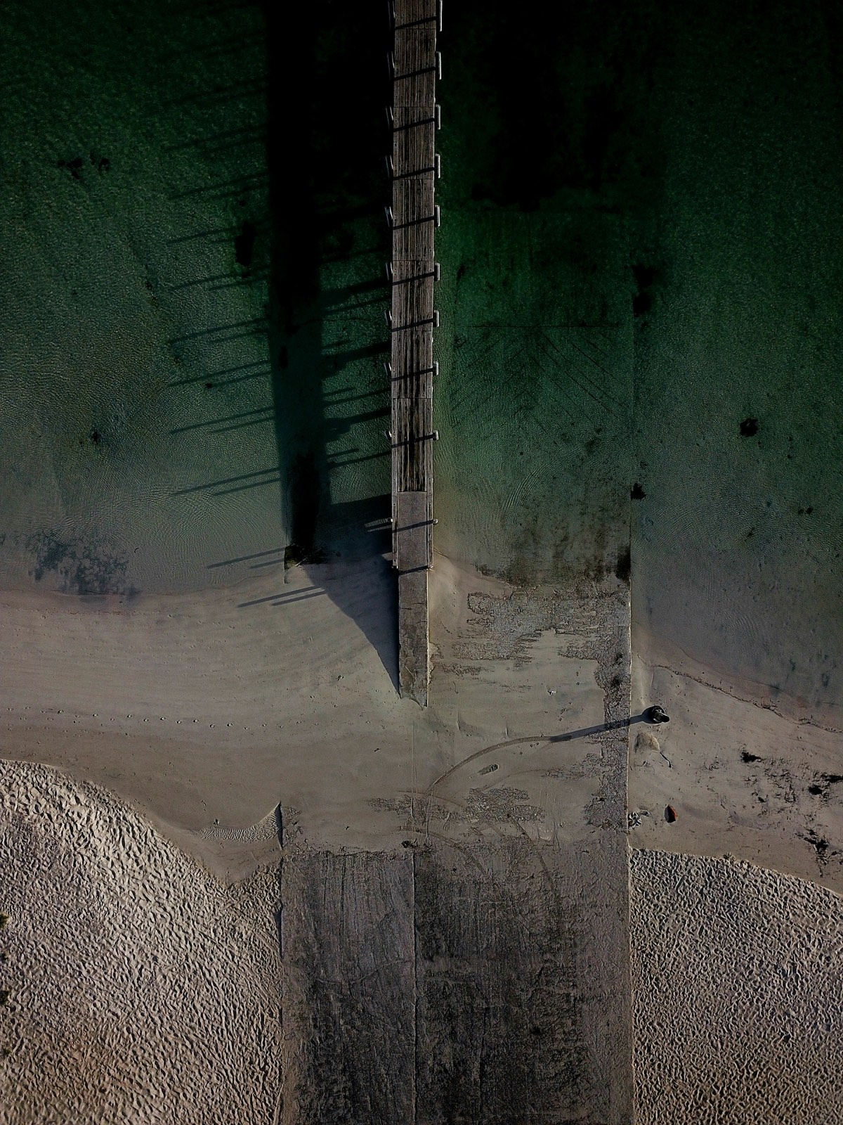 Aerial view of a jetty on the calm waters of Geographe Bay near Quindalup